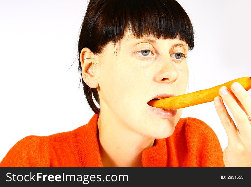 Young beautiful girl eating fresh orange. Young beautiful girl eating fresh orange