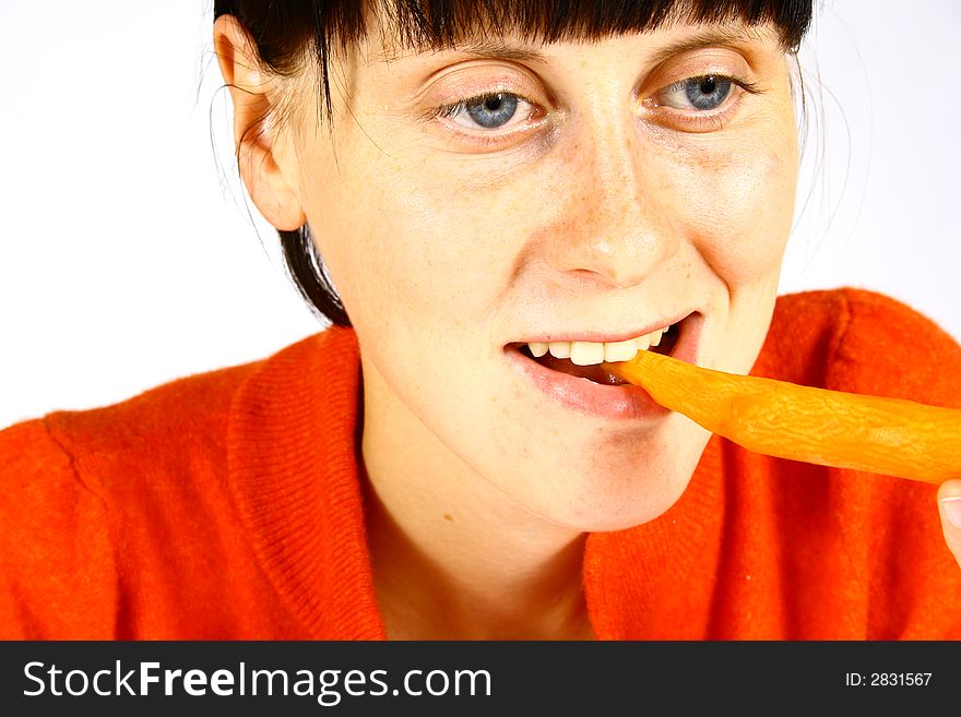 Young beautiful girl eating fresh orange. Young beautiful girl eating fresh orange