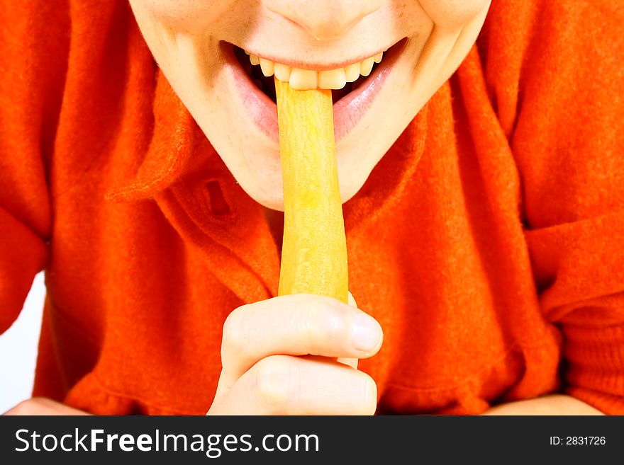 Young beautiful girl eating fresh orange. Young beautiful girl eating fresh orange