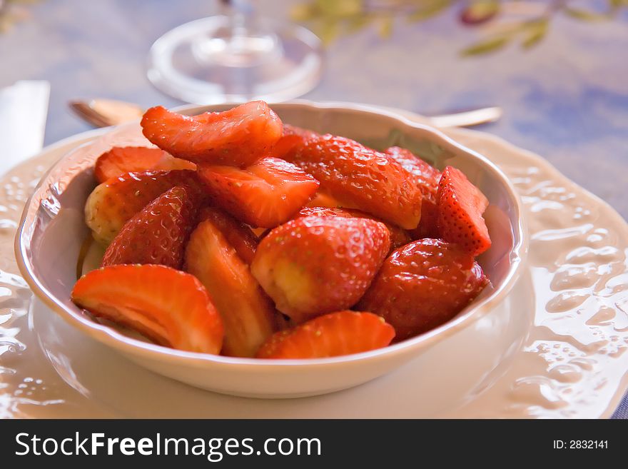 Plate of strawberries on a table. Plate of strawberries on a table