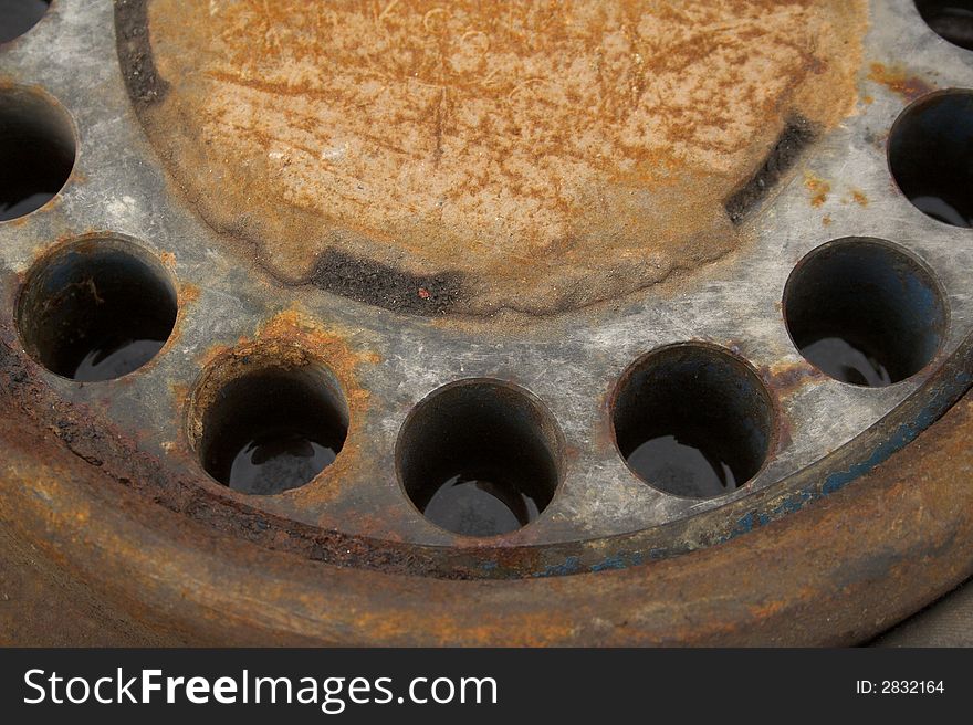 Some rusty machinery with five holes