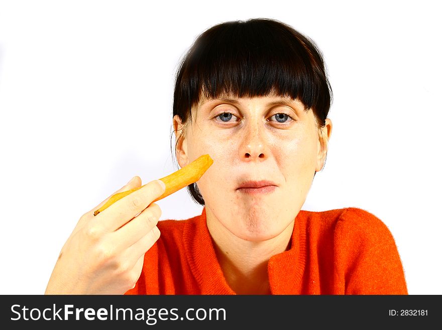 Young beautiful girl eating fresh orange. Young beautiful girl eating fresh orange