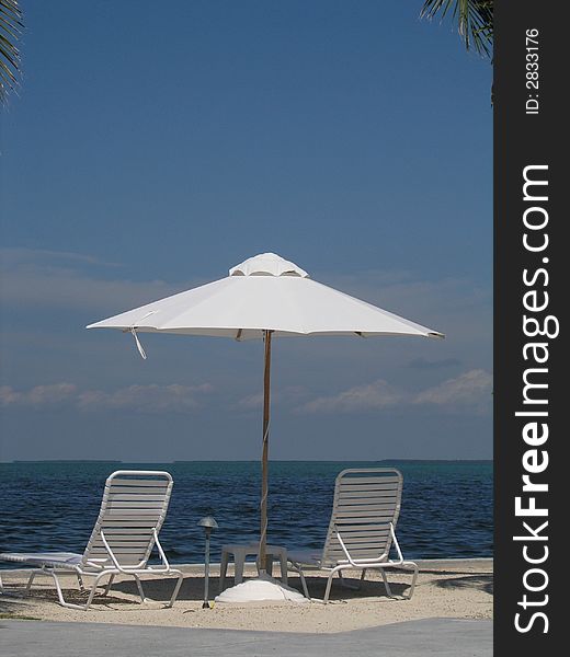 Waterfront umbrella and chairs