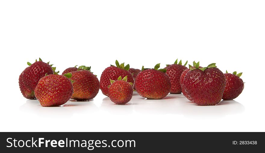 Colorful strawberries isolated over white background