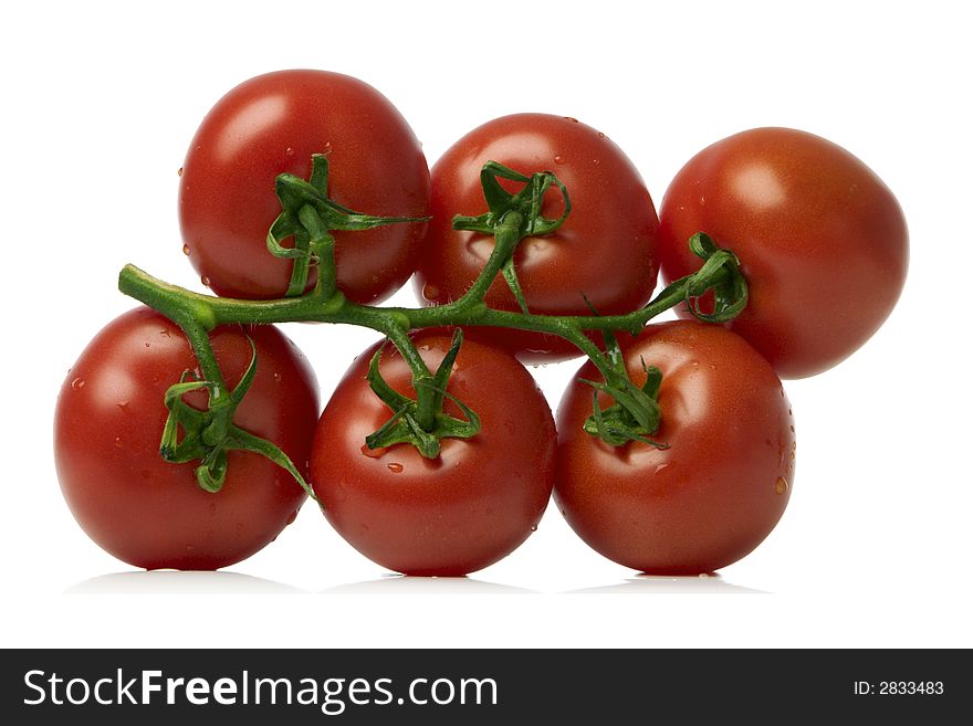 Bunch of red tomatoes over white background