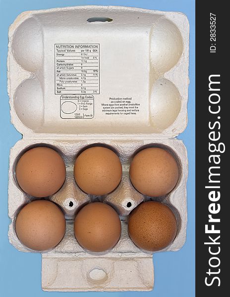 A pack of six fresh eggs in a box containing nutritional information.