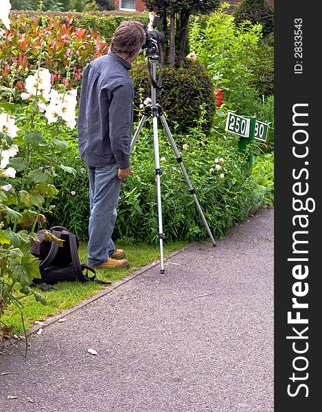 Professional Photographer getting ready with Tripod for Photo shoot. Professional Photographer getting ready with Tripod for Photo shoot