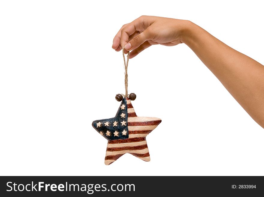 A hand holding a star symbolizing the country of USA. A hand holding a star symbolizing the country of USA
