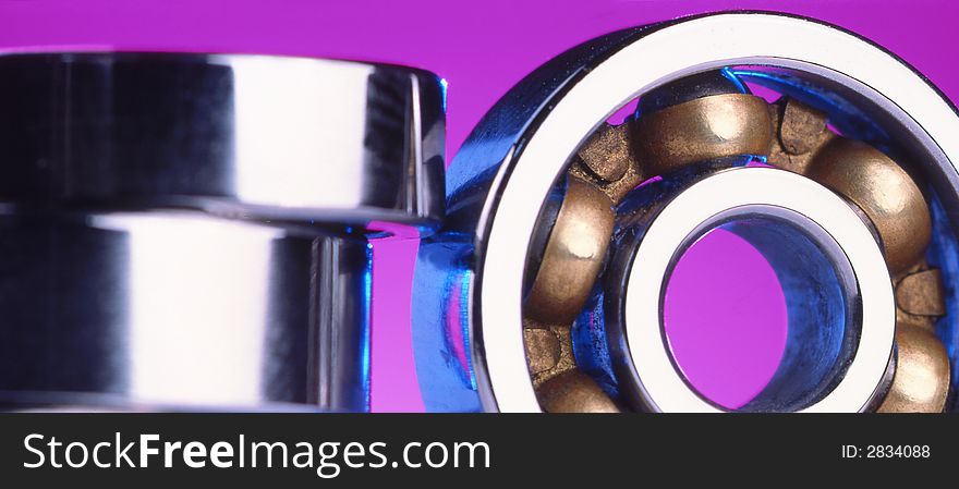 Industrial bearings on a violet background