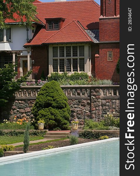 Old heritage mansion with fountain and pond in front of it. Old heritage mansion with fountain and pond in front of it