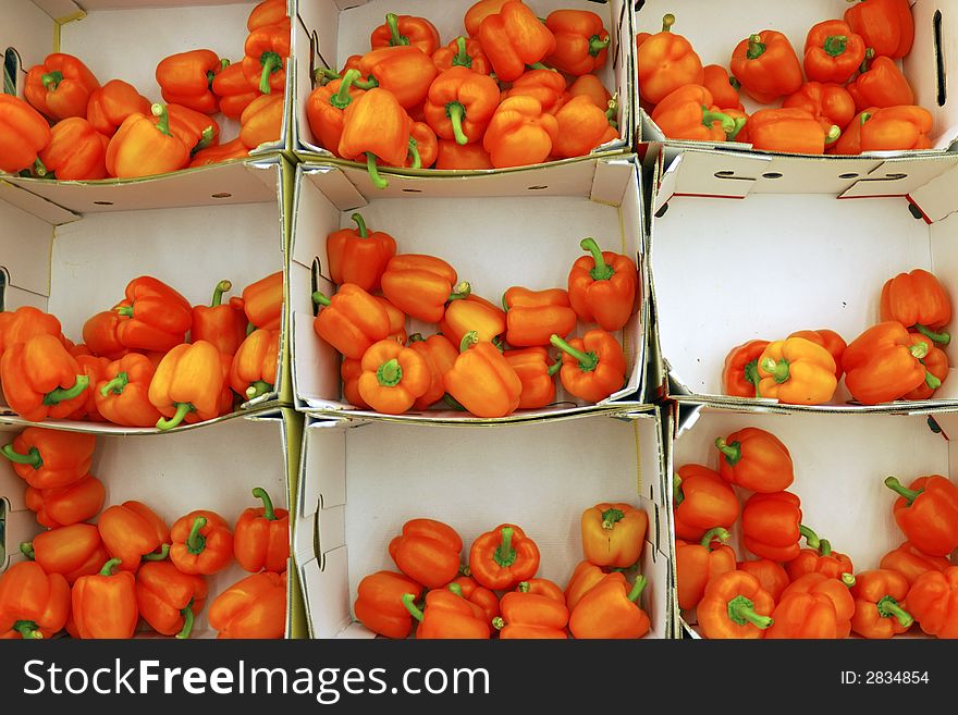 The orange peppers in carton box