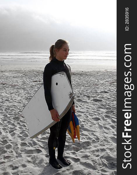 Body-boarder girl ready to go surfing. Body-boarder girl ready to go surfing