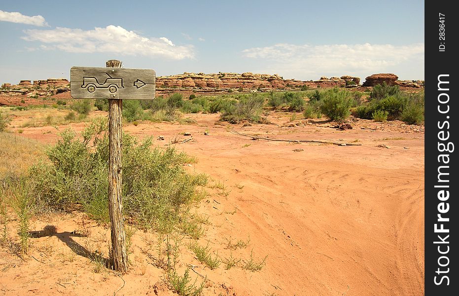 Directional sign with fun picture of a jeep at Canyonlands. Directional sign with fun picture of a jeep at Canyonlands.