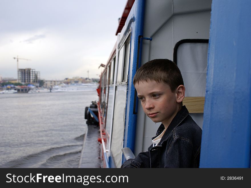 Portrait of the boy by the ship