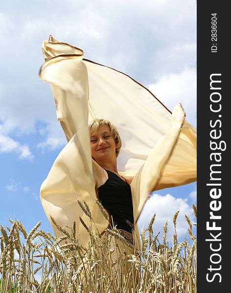 Girl in the middle of a wheaten field. Girl in the middle of a wheaten field