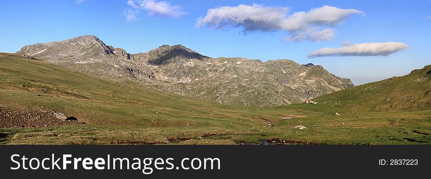 Panorama with rocky peaks and meadows. Panorama with rocky peaks and meadows