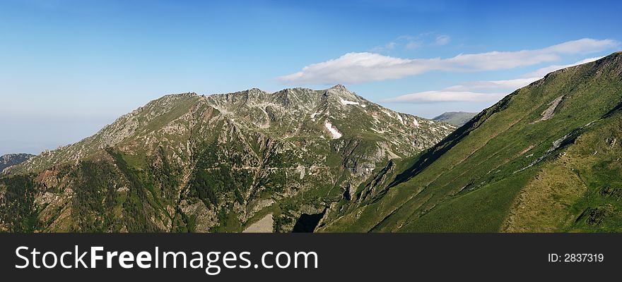 Panorama with peaks and meadows. Panorama with peaks and meadows