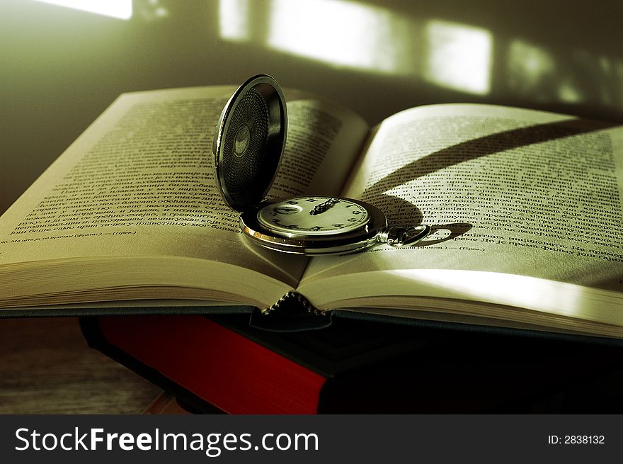 Photo old pocket watch on the book