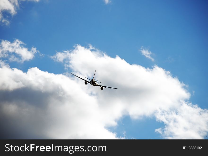 Jet plane on a nice blue sky with clouds. Jet plane on a nice blue sky with clouds