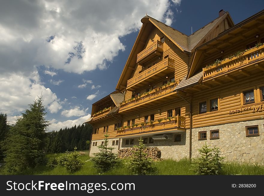 Luxury traditional mountain hotel made of wooden planks. Luxury traditional mountain hotel made of wooden planks.