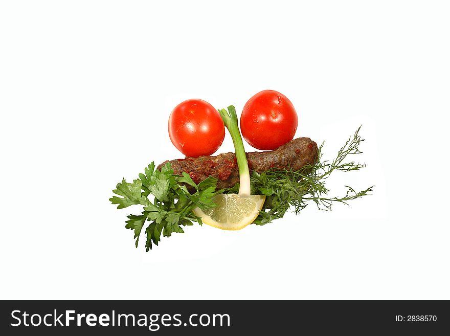 Kebab, tomatoes, onion, parsley and lemon on a white background. Kebab, tomatoes, onion, parsley and lemon on a white background