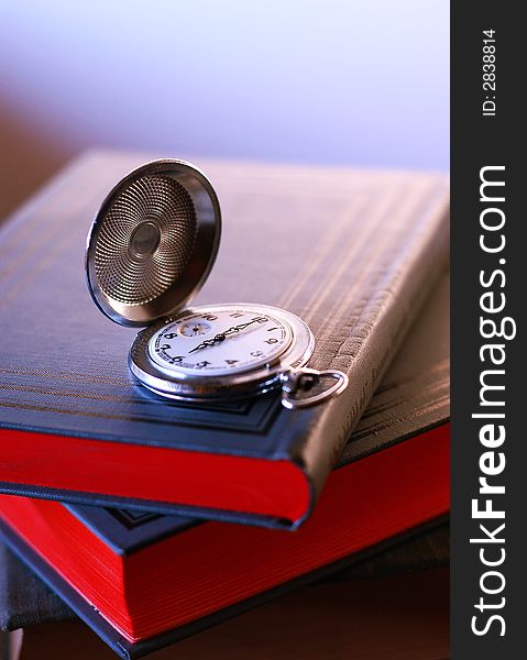 Photo old pocket watch on the book