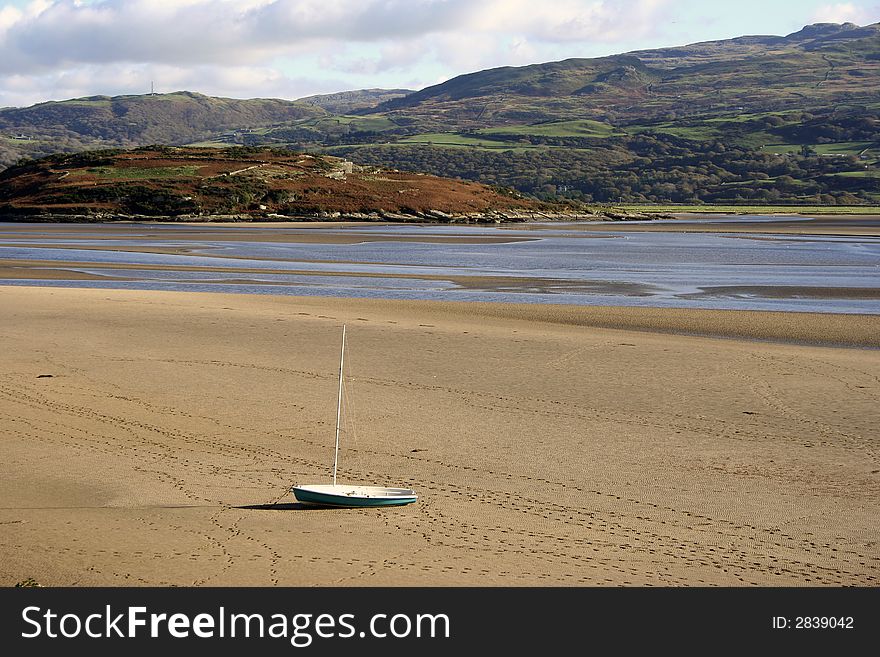 Deserted Boat on Sand at low tide