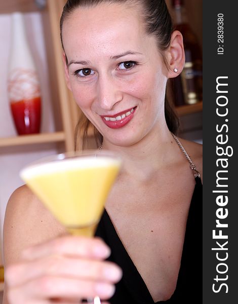 woman holding a cocktail in the hand. woman holding a cocktail in the hand