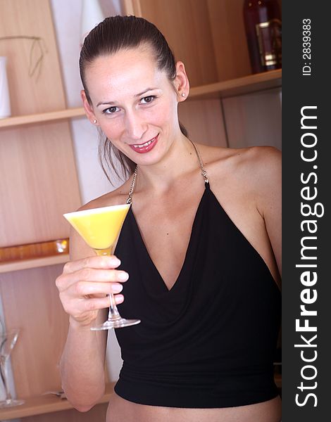 woman in party dress holding cocktail. woman in party dress holding cocktail