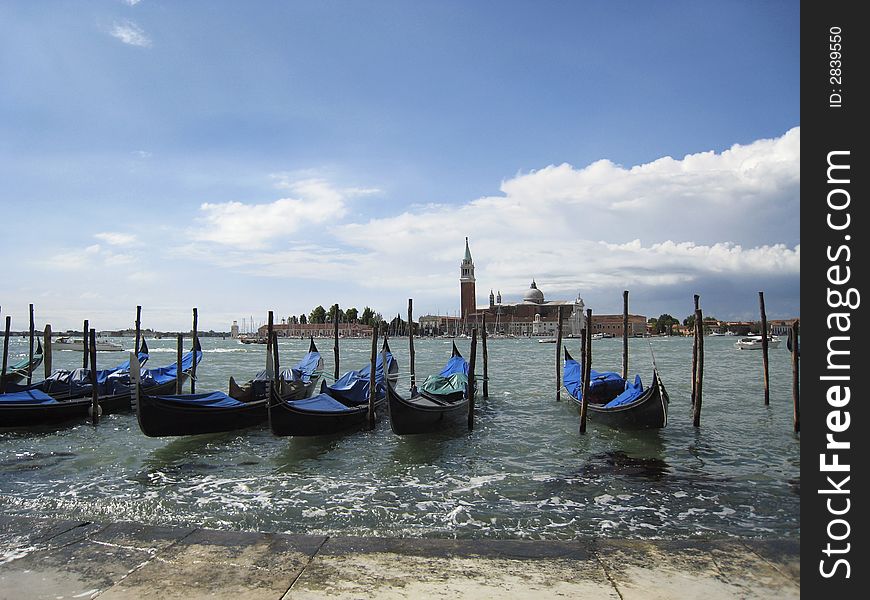 Gondolas in the water at Venice, Italy. Gondolas in the water at Venice, Italy