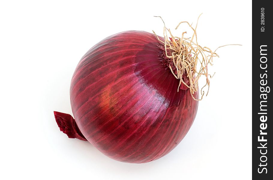 A raw red onion ready for preparation - on a white background.