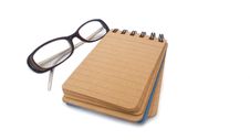 Notebook With Glasses Stock Images