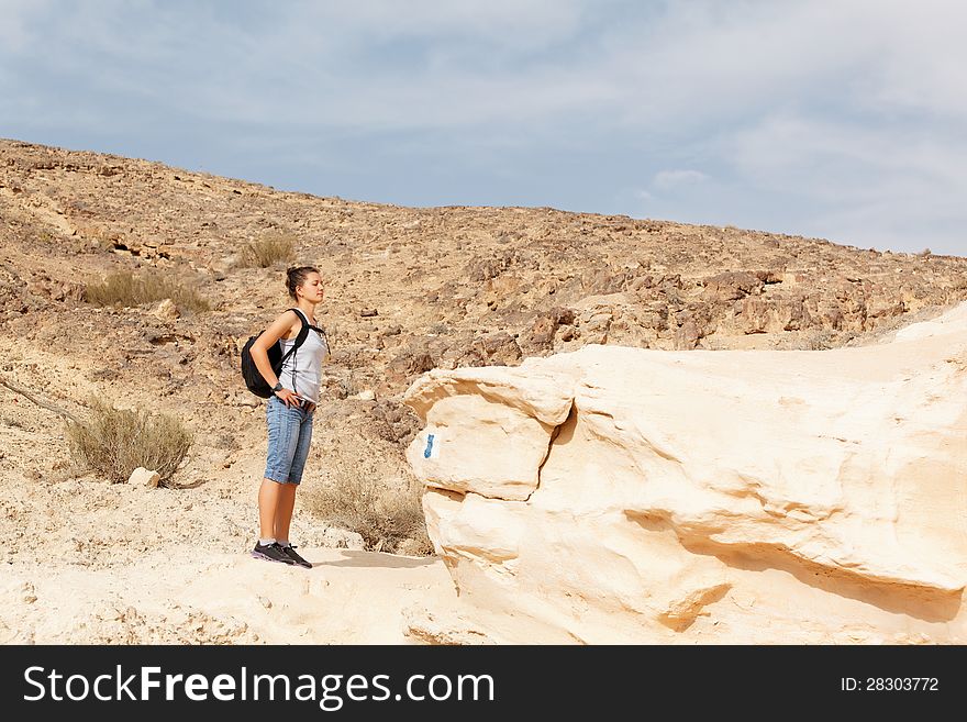 Girl wandering the desert mountains. Girl wandering the desert mountains