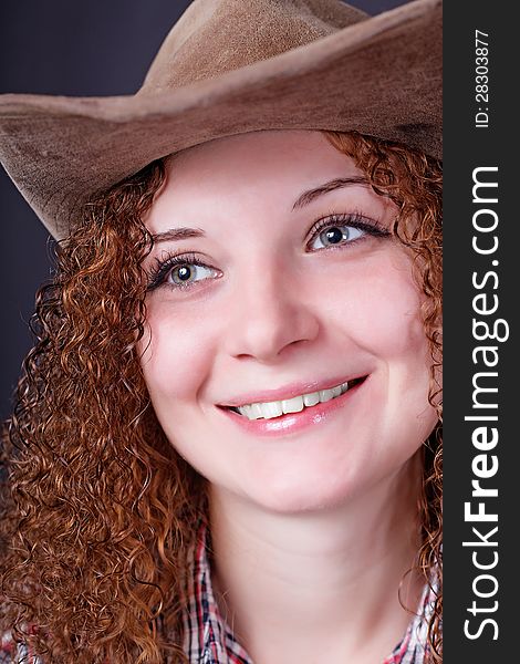 Portrait of girl smiling in a cowboy hat. Portrait of girl smiling in a cowboy hat