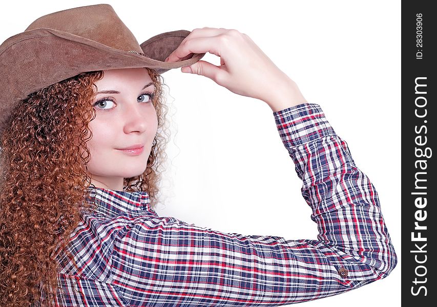 Portrait of curly girl in a cowboy hat