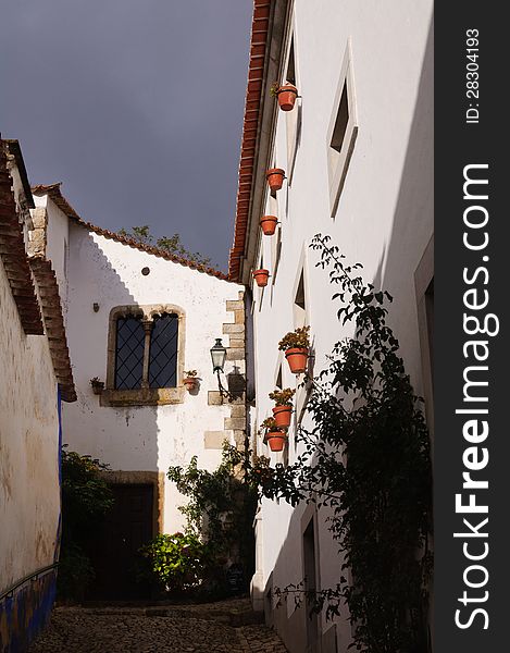 Old Beautiful Houses In Medieval City Of Obidos, Portugal