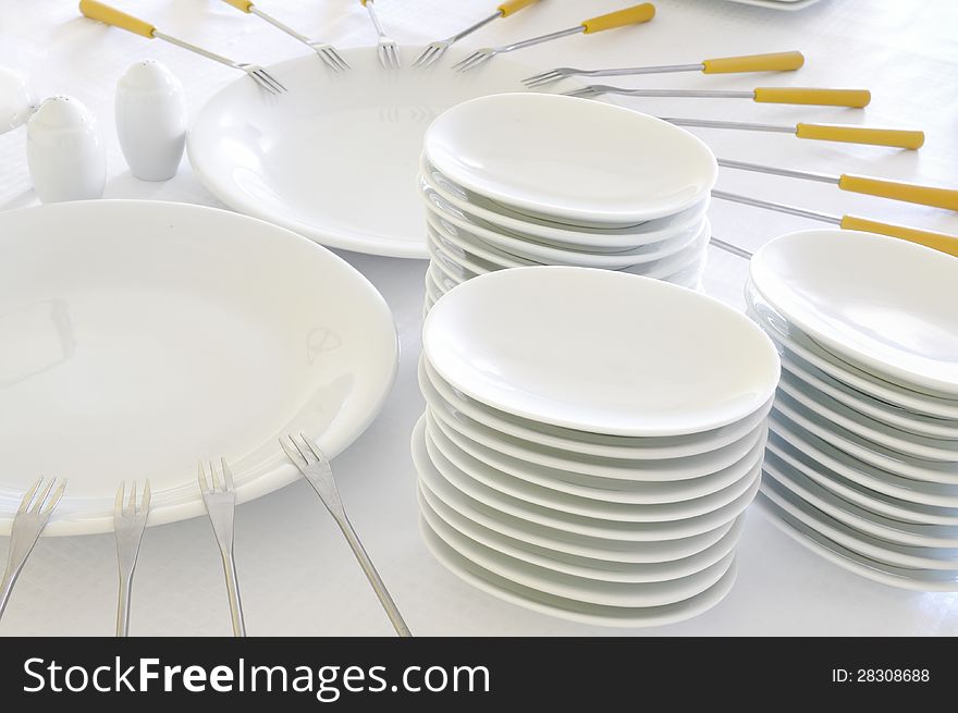 Empty white plates with forks. Empty white plates with forks
