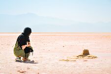 Free Female Traveler Tourist Sit Visiting Explore Maharlu Pink Salt Lake Shore. Travel Destination Iran In Shiraz Royalty Free Stock Images - 283020209