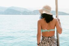 Free Caucasian Woman Tourist Relax Lay On Vacation On Cruise Ship Deck Enjoy Sunny Persian Gulf Panorama With Rocky Mountains Cliffs. O Stock Images - 283020394