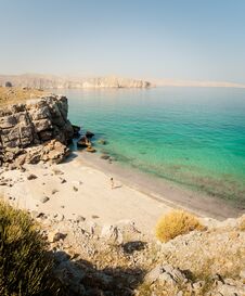 Free Side Panoramic View Tourist Woman In Bikini Walk On White Sand Beach To Turquoise Water In Persian Gulf Mirellas Island. Musandam. Royalty Free Stock Photos - 283020638
