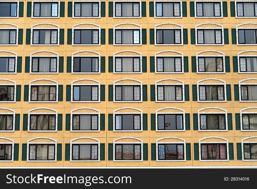 Rows and columns of identical windows in a large building