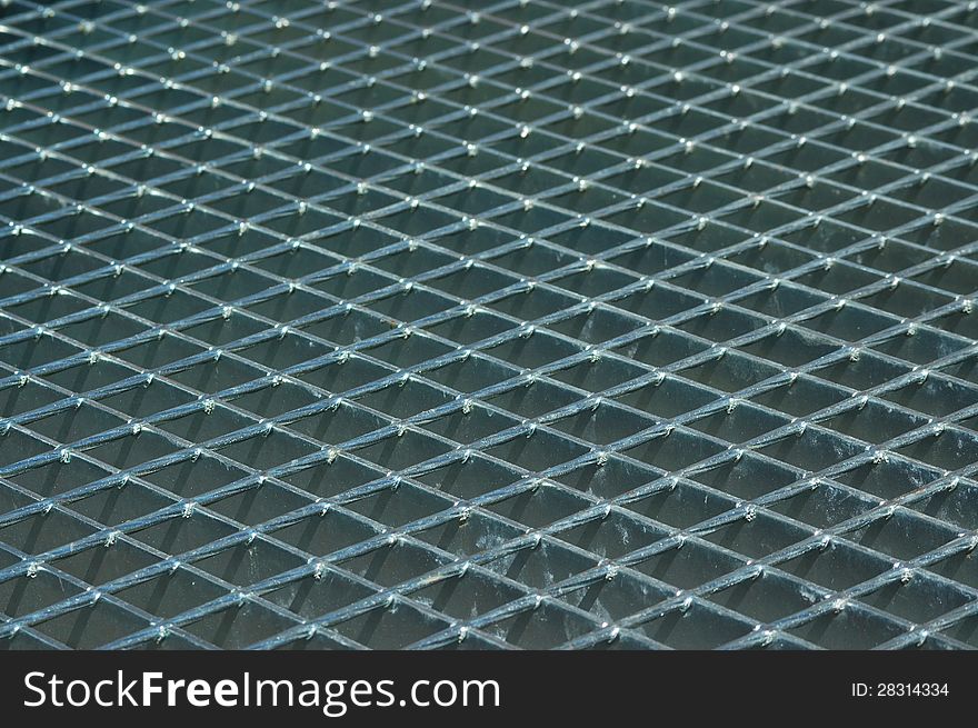 Metal grid on floor stairwell