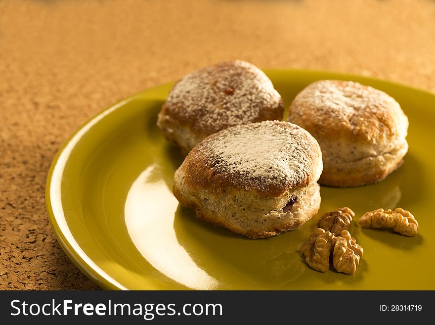 Sweet donuts with nuts and sugar