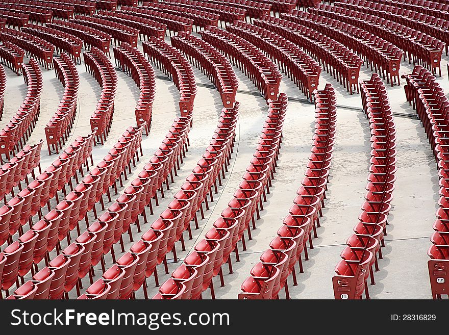 Empty red seats in an auditorium in the open air. Empty red seats in an auditorium in the open air