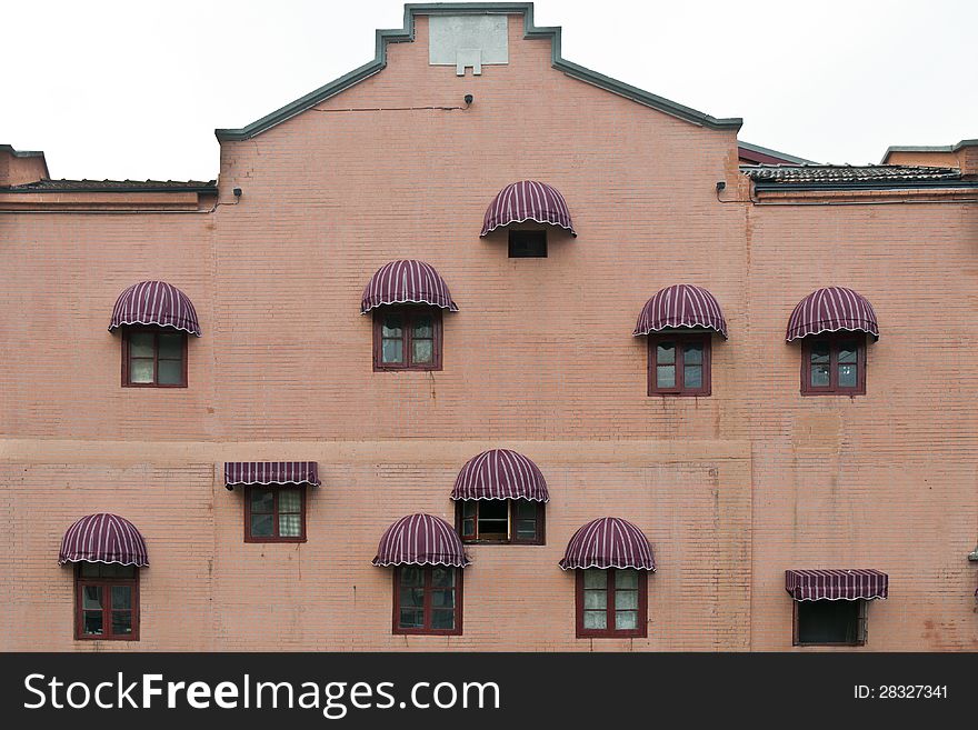 The facade of a building with arched sunshades