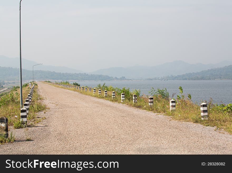 Dam road and lake in Thailand.