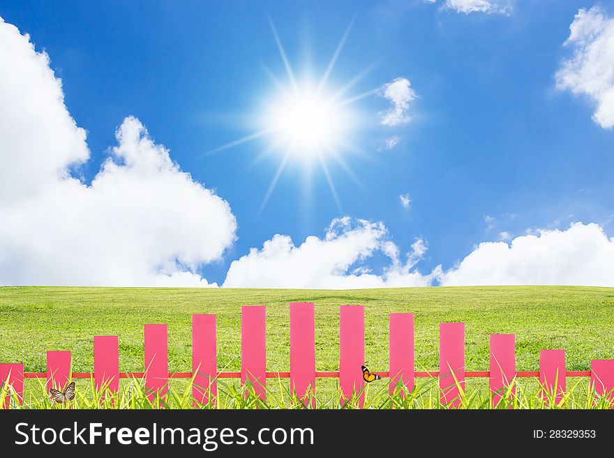 Colourful Spring Background  With Pink Fence Against Blue Sky