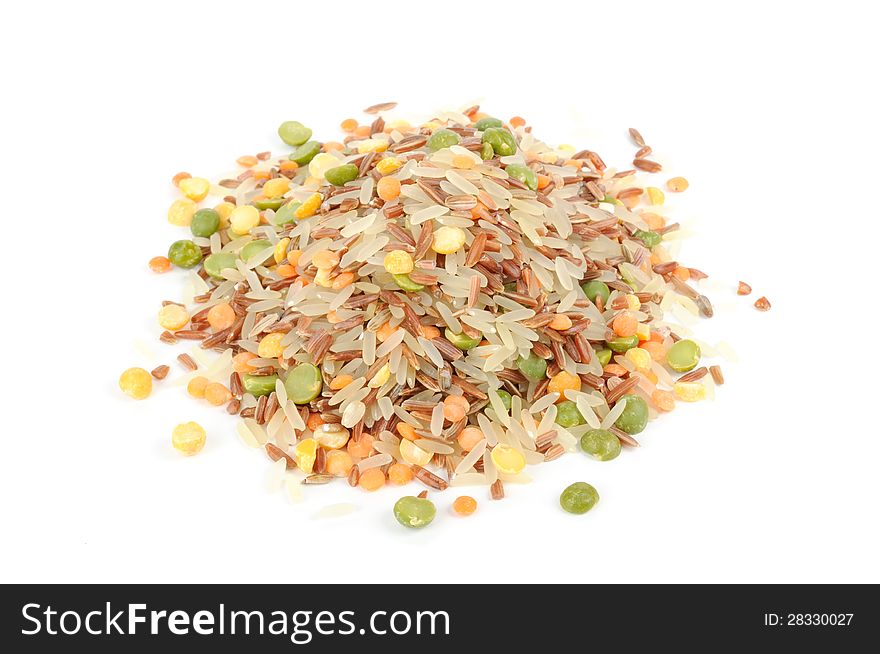 A pile of rice and legume mix (parboiled and red rice, split peas and lentils) on white background