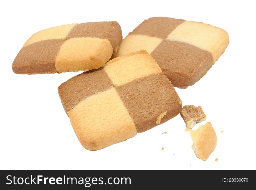 Square check board cookies with crumbs isolated on a white background. Square check board cookies with crumbs isolated on a white background