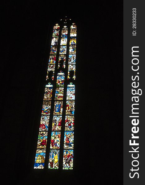 Big glass window inside of duomo cathedral in milano italy